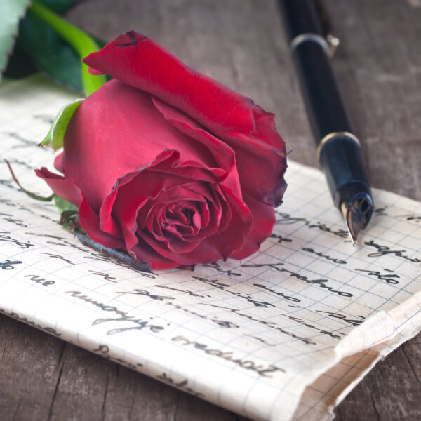 Love letter and rose close up